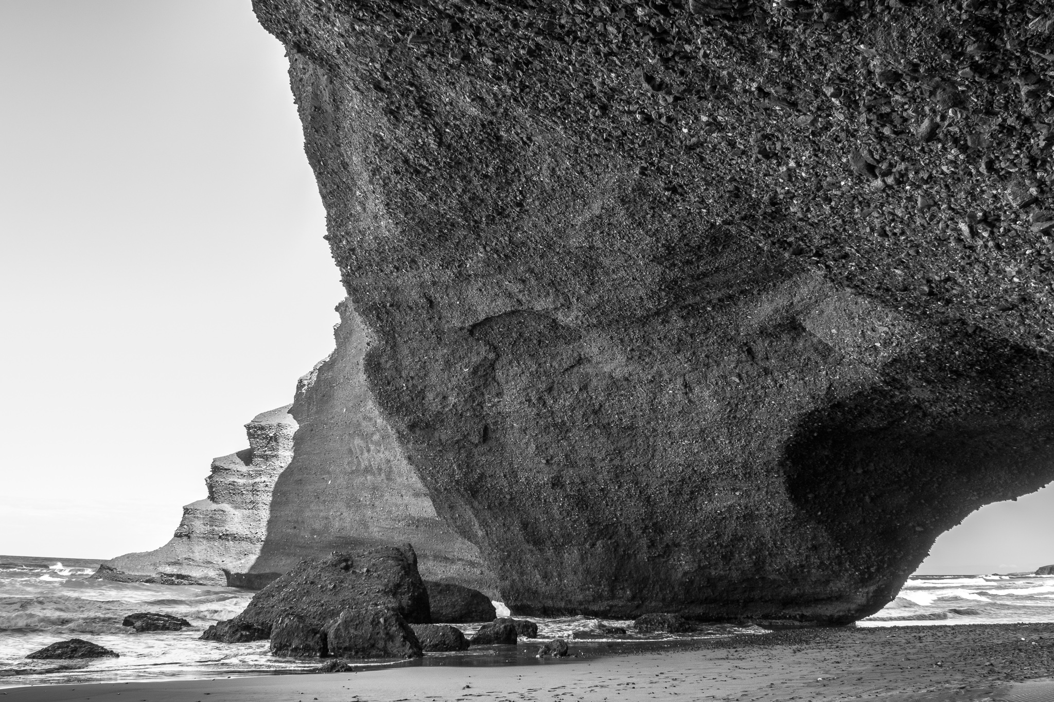 The beach of Legzira is located about 10 km north of the village of Sidi Ifni, the former Spanish colony of Morocco. <br> Its monumental natural bridges, red stone arches and elephant's foot, have been carved by marine erosion for centuries. <br> Recently, in 2016, after a cracking collapsed one of the most emblematic arches of the beach.