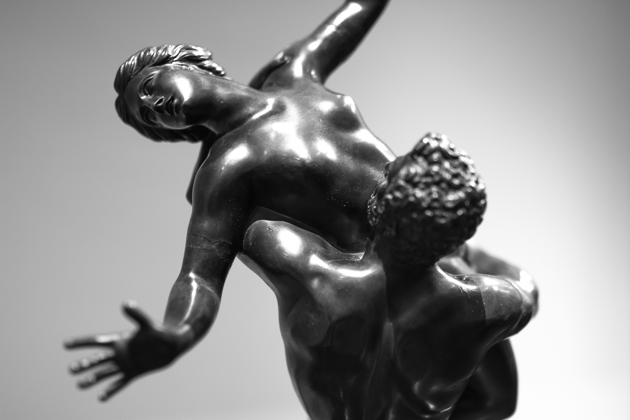 Bronze replica of Giambologna's sculpture, 'The Rape of the Sabina Women', originally carved in white marble approximately 4m high and located in Florence, Italy.<br> According to the legend, after Romulus has founded the city of Rome, women were sought among the people of the Sabines, who after opposing and trying to prevent it, were deceived and all their women were captured.